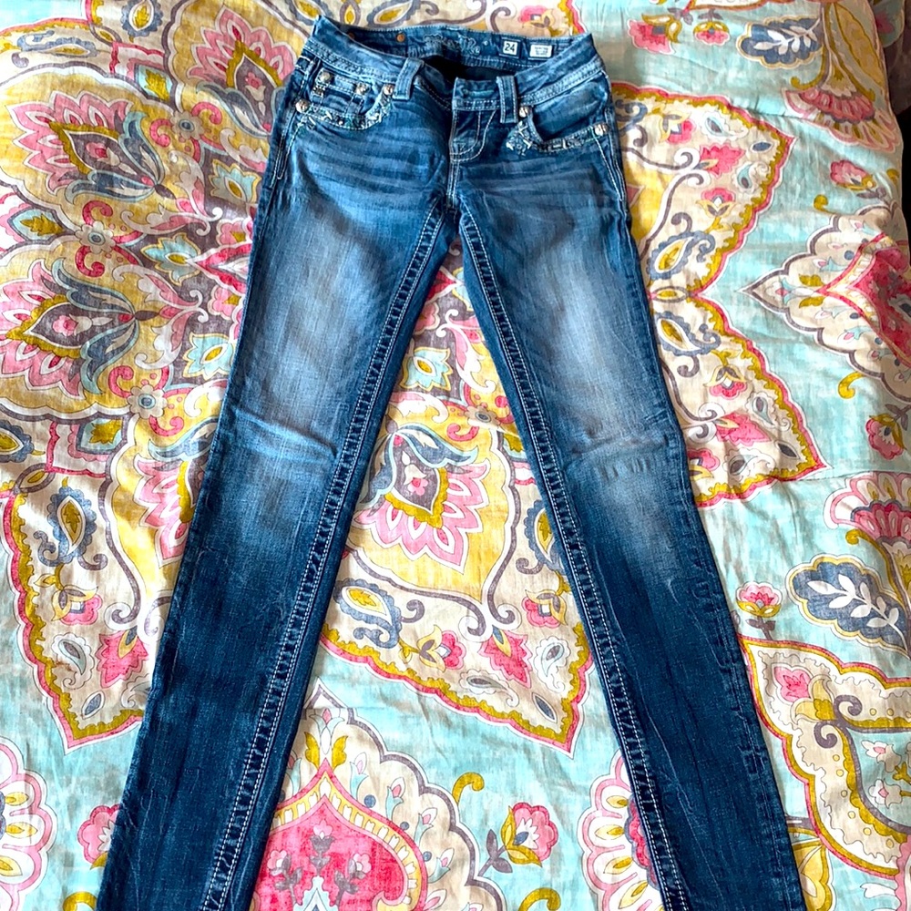 Blue signature skinny jeans, but dazzled, back and front pockets